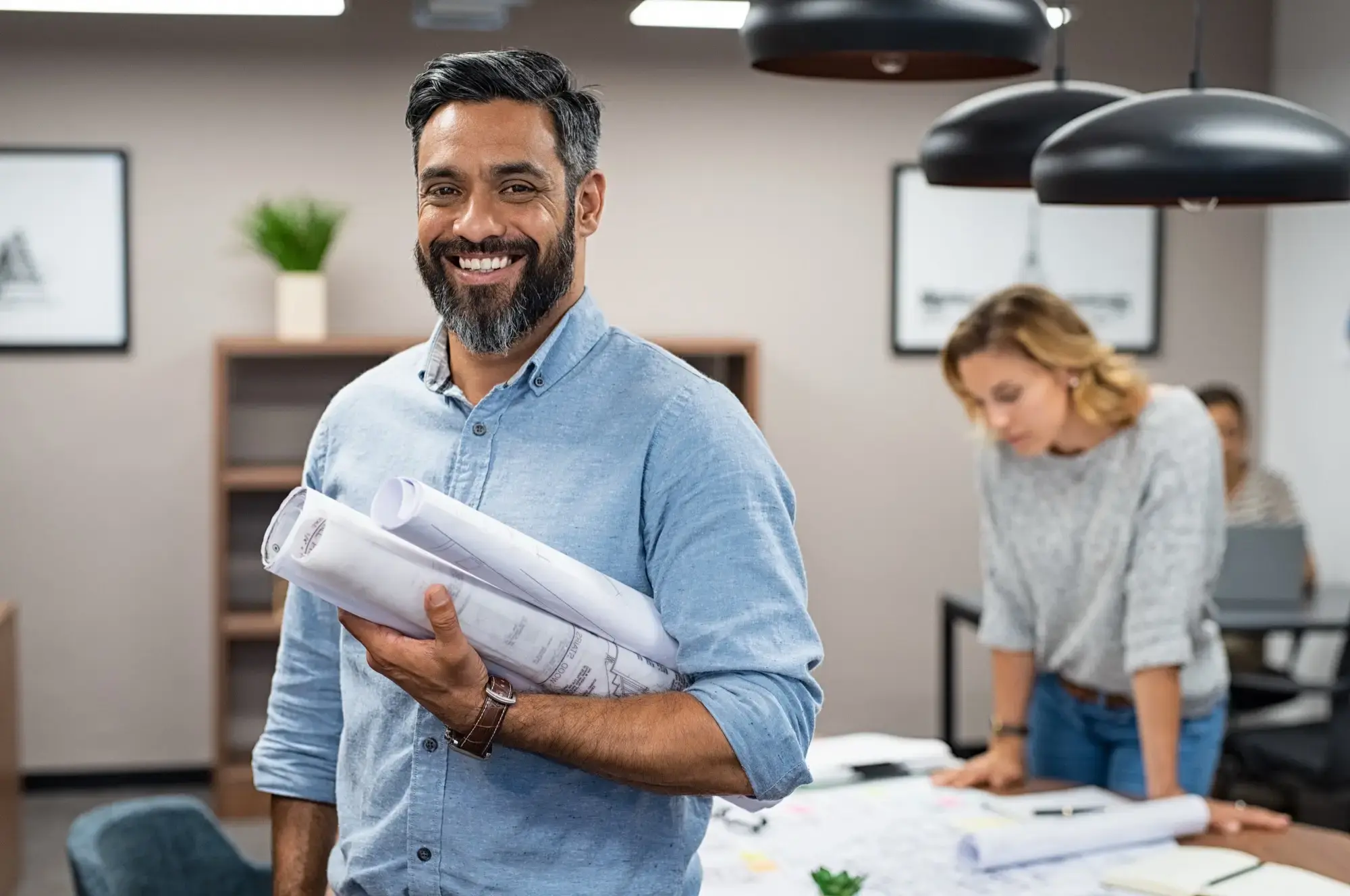 man smiling in office setting