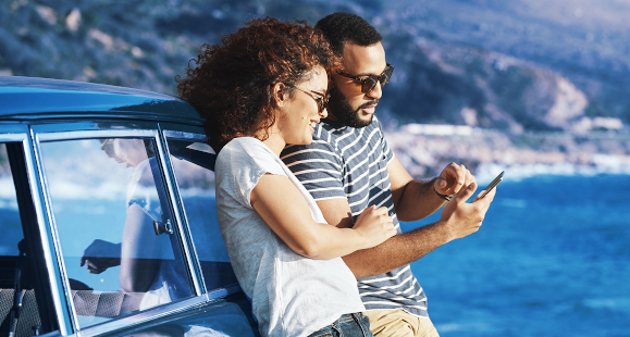 two people looking at a cell phone