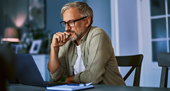 man looking at his computer screen